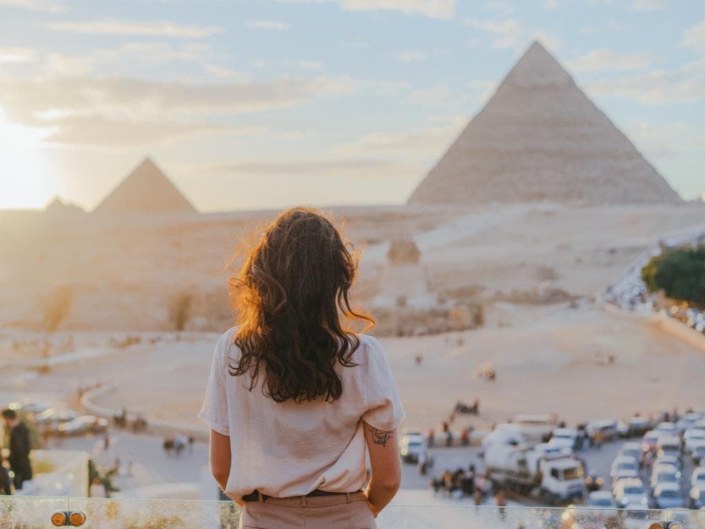 Person looking at pyramid on vacation L